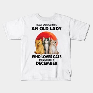 Never Underestimate An Old Lady Who Loves Cats And Was Born In December Kids T-Shirt